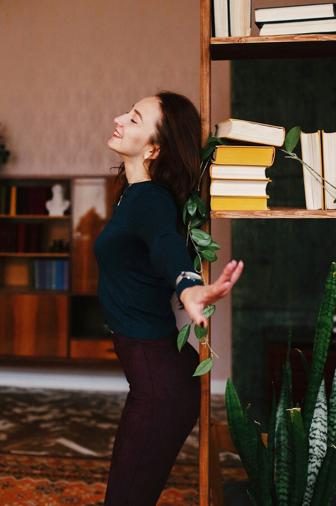 Smiling Latin American woman reader holding a book